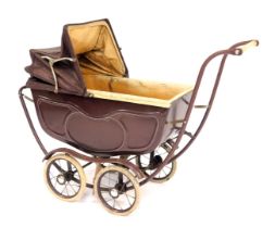 A vintage doll's pram, steel framed with cream and brown painted decoration, 68cm high, 87cm wide.