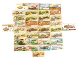 A collection of Airfix model kits, for planes and armoured vehicles, to include two crusader tanks,