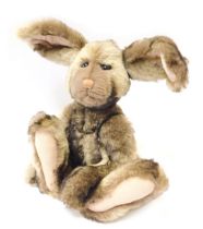 A Charlie Bears hare, with articulated limbs, bearing label, CB141222, 33cm high.