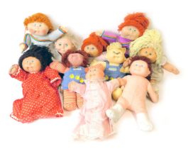 A collection of Cabbage Patch and other full sized dolls. (1 box)