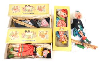 Four Pelham puppets, comprising Mint Witch, Crown, Mint Gypsy, boxed, and one unboxed in kilt. (4)