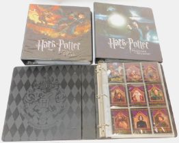 Three Harry Potter Collectors card albums, for The Goblet of Fire, Prisoner of Azkaban and The Sorce