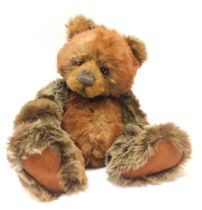 A Charlie Bears brown Teddy bear, with bell collar and articulated limbs, bearing label, 42cm high.