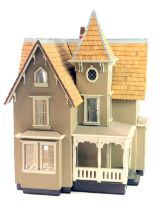 A painted doll's house, modelled as a Tudor house with slatted roof, 50cm high, 34cm wide.