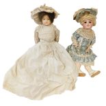 A 19thC continental porcelain headed doll, unmarked, with fixed painted eyes and teeth, in lace gown