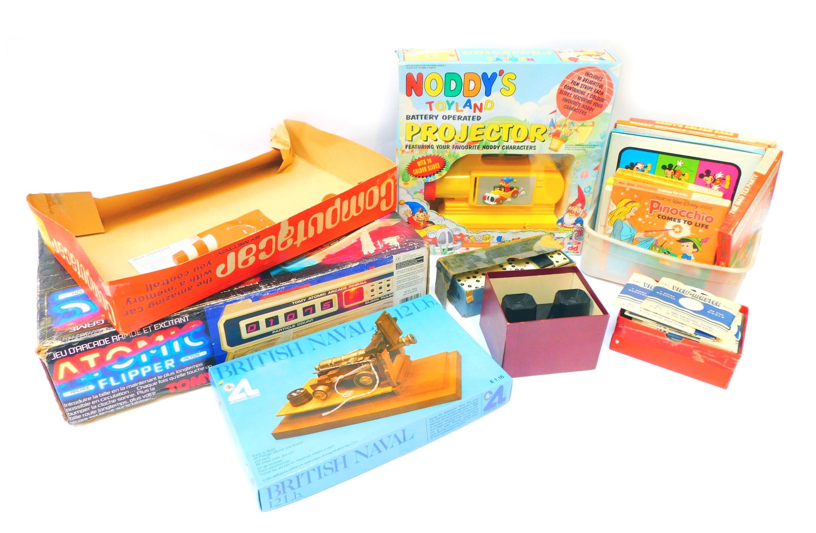 Various toys and games, comprising Atomic Pinball by Tomy, Noddy's Toy Land projector, View Master a
