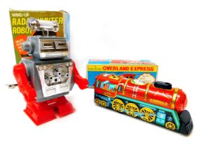 A Busy Bee windup radar hunter robot, and a windup Overland Express by Yone of Japan, boxed. (2)