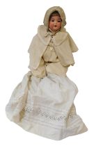 An Armand Marseille bisque headed German porcelain doll, with roll blue eyes and open mouth, on papi