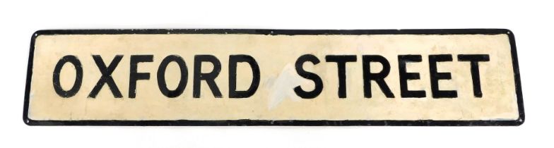 An Oxford Street metal street sign, over painted in cream and black, 23cm high, 114cm wide.