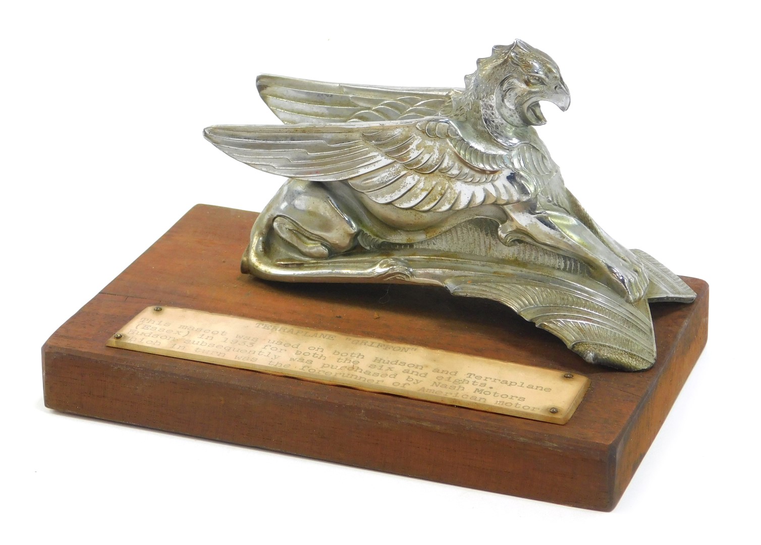 A Terraplane Griffin car mascot, used on both Hudsons and terraplanes, mounted on a rectangular wood
