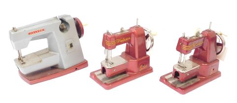 Three Vulcan child's sewing machines. (3)