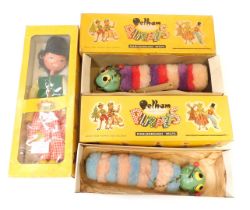 Three Pelham puppets, comprising Dutch boy and two caterpillars, boxed. (3)