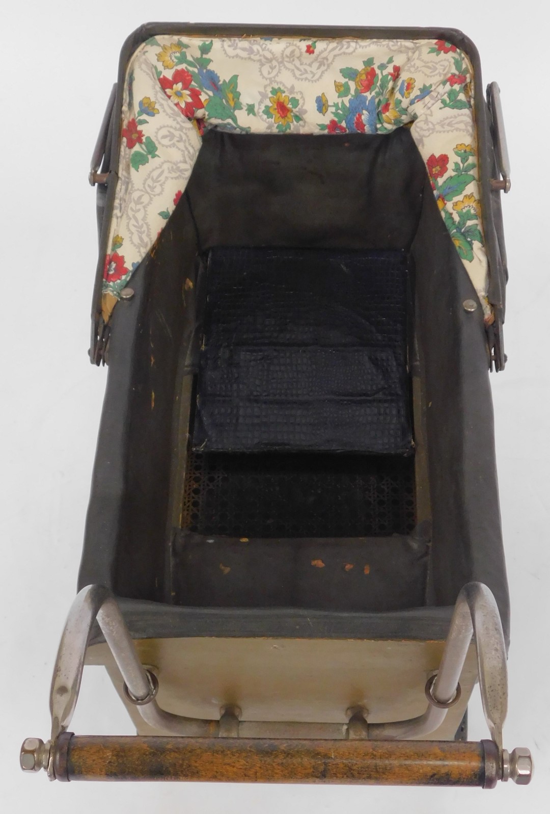 A 1950s Triangtois (Line Bros ltd) doll's pram, with a brown painted base, and floral hood, 66cm hig - Image 2 of 3