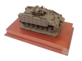 A Martin Duchemin armored tank model, bronzed effect set on a yew wood rectangular base, 12cm high,