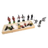 Painted lead soldiers and figures, comprising cavalry officers, station masters, and a set of Snow W
