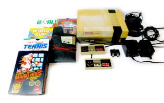 A Nintendo Entertainment System (NES), including accessories and games, including Super Mario Brothe