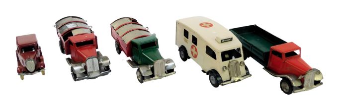 Four Minic Toys clockwork vehicles, comprising two cars, flatbed truck, ambulance, together with a T