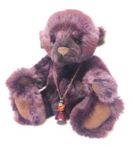 A Charlie Bears purple Teddy bear, bearing label, 34cm high.