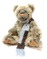 A Charlie Bears grey two toned Teddy bear, with blue scarf, bearing label, 41cm high.