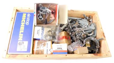 A collection of bicycle parts, to include brake handles, pedals, Air Stop Michelin inner tubes, etc.