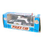 An Ichico of Korea friction powered tinplate police car, boxed.