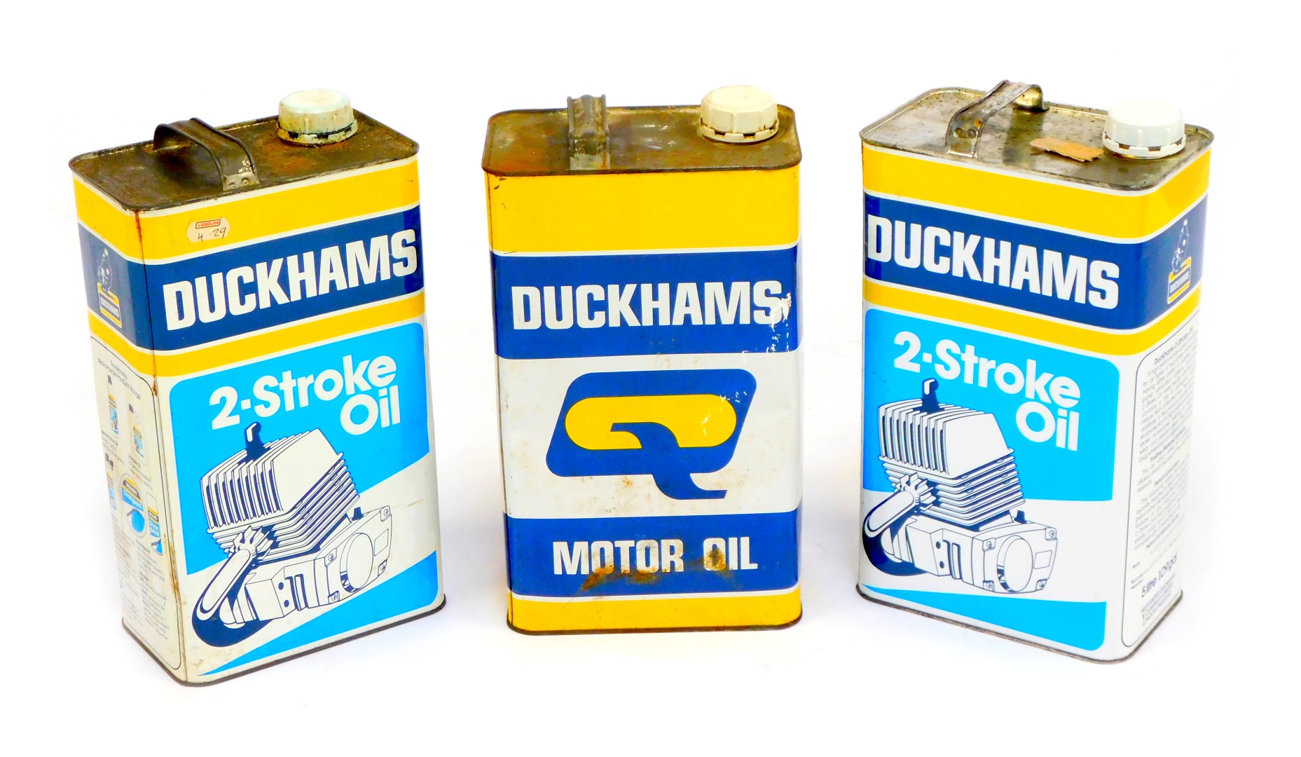 Three Duckham's Two Stroke vintage oil cans, partially filled. (3)