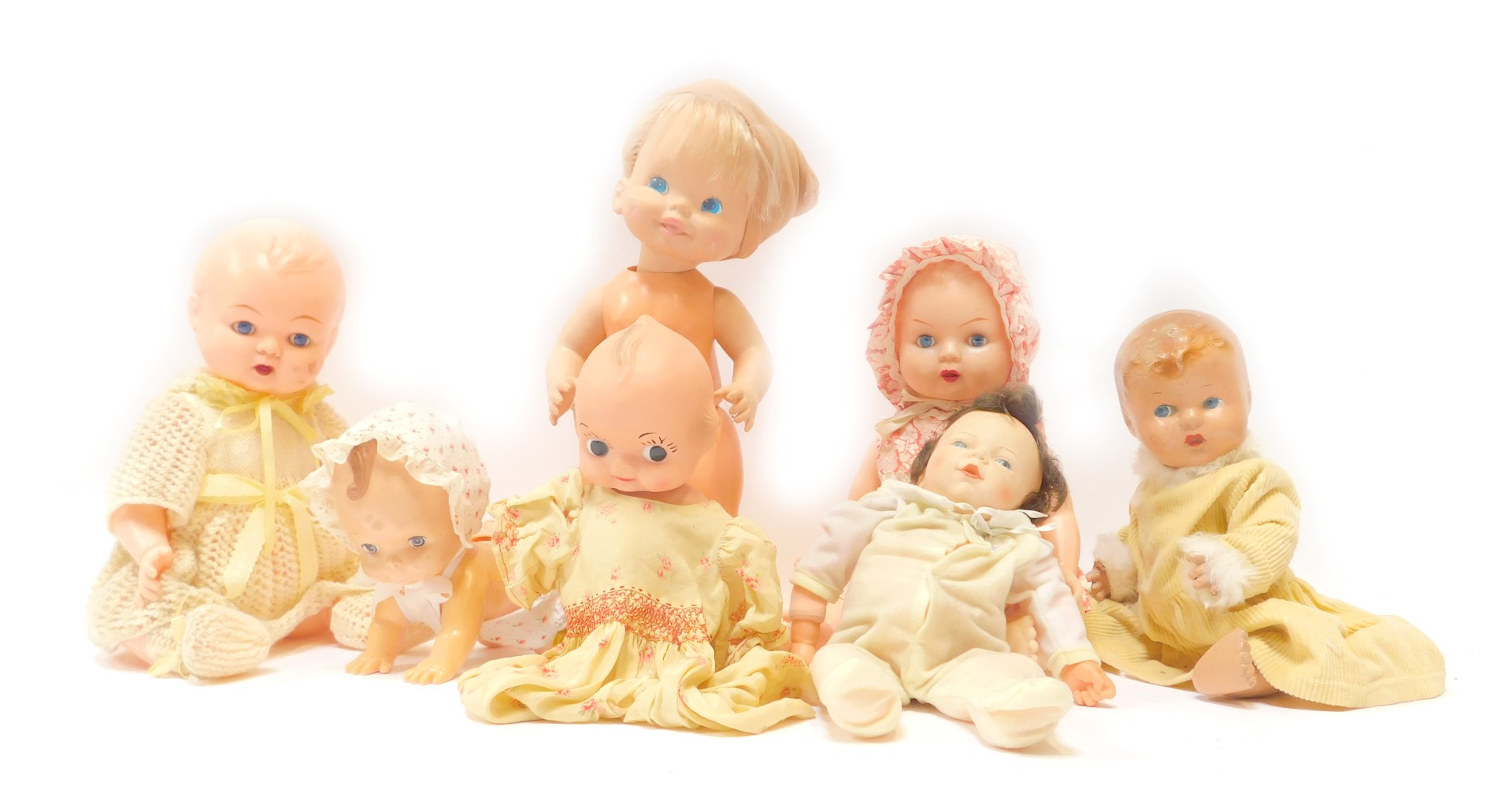 A group of plastic dolls, comprising mainly babies and children, some with clothing. (1 box)