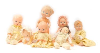A group of plastic dolls, comprising mainly babies and children, some with clothing. (1 box)