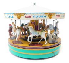 A Franklin Mint Romance model carousel, painted for advertising of Gallopers, with musical twist bas