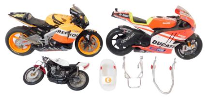 Three model motorbikes, comprising Ducati and Honda, and a Raleigh 3 bike. (3)