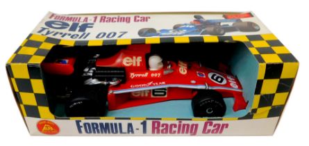 An Alps Formula 1 racing car Elf Tyrrell 007 battery powered car, boxed.