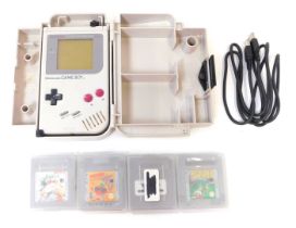 A Nintendo Gameboy and group of games, to include Tennis, Snoopy, Kwirk, and Tetris, in carry case.