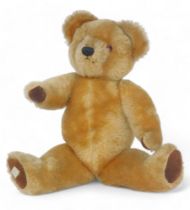 A 1950's Chad Valley plush jointed Teddy bear, bearing label to foot, 36cm high.