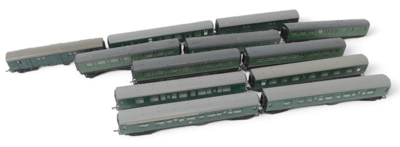 Tri-ang and other OO gauge carriages, in green livery.