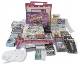A cased folding dolls house, together with games, to include Don't Panic, Twister, video games, cds