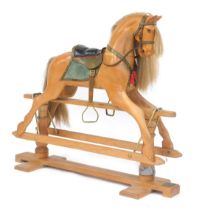 A Stevenson Brothers of England waxed oak rocking horse, No 1011, 1992, with real horse hair mane an