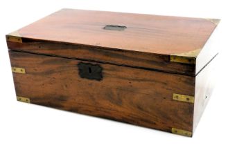 A Victorian mahogany and brass bound writing slope, the hinged lid opening to reveal a slope and fit