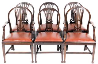 A set of six George III style mahogany dining chairs, with hogs backs, including two carvers.
