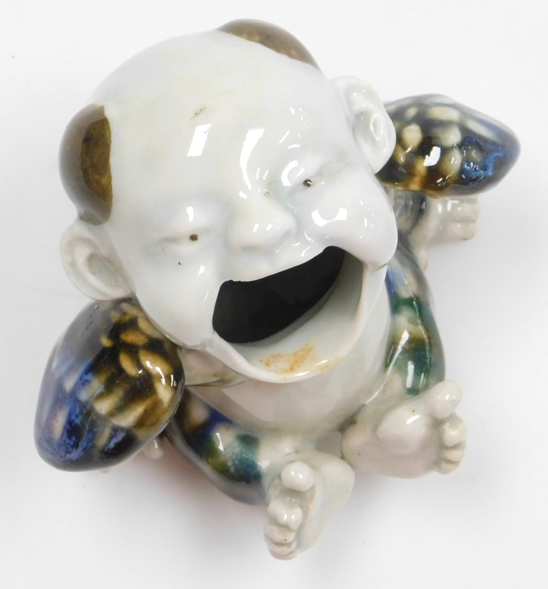 A Meiji period Japanese Hirado ware porcelain hand brazier, modelled as a winged, seated boy, his mo - Image 5 of 7