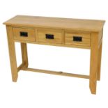 A light oak side table, with three frieze drawers, on stiles, 78cm high, 110cm wide.