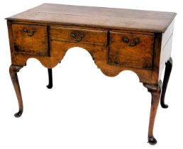 An 18thC oak low boy, with moulded top, three frieze drawers and cabriole legs with pad feet, 78cm h
