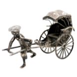 A late 19th/early 20thC Chinese silver model of a man pulling a rickshaw, marks for Luen Wo, 1.23oz.