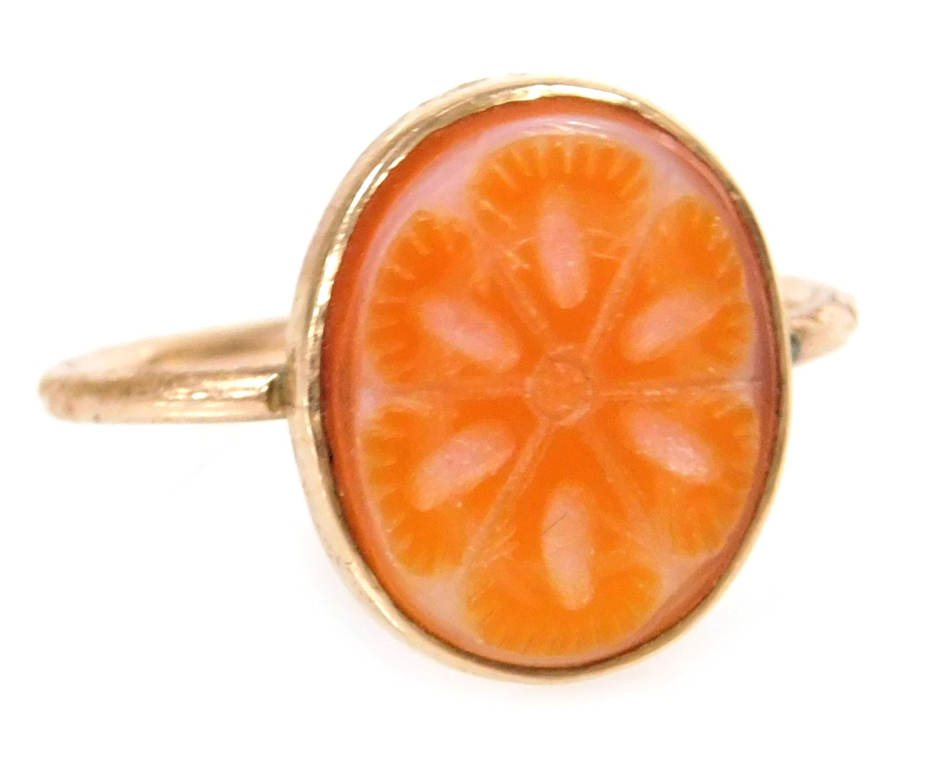 A lady's Sardonyx ring, carved in a floral design, set in yellow metal, size O, 1.7g all in.