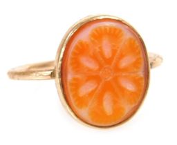 A lady's Sardonyx ring, carved in a floral design, set in yellow metal, size O, 1.7g all in.