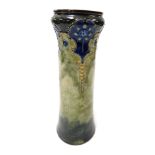 A late 19thC Royal Doulton stoneware vase, moulded with stylised flowers and trailing leaves, on a b