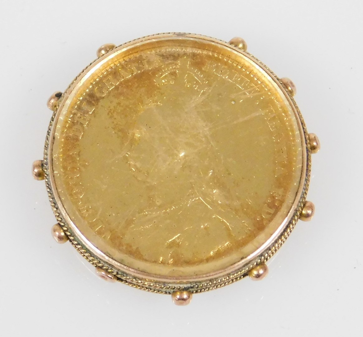 A Queen Victoria jubilee head coin 1887 with shield back, enamel inlaid, in a 9ct gold and glass bac - Image 2 of 2