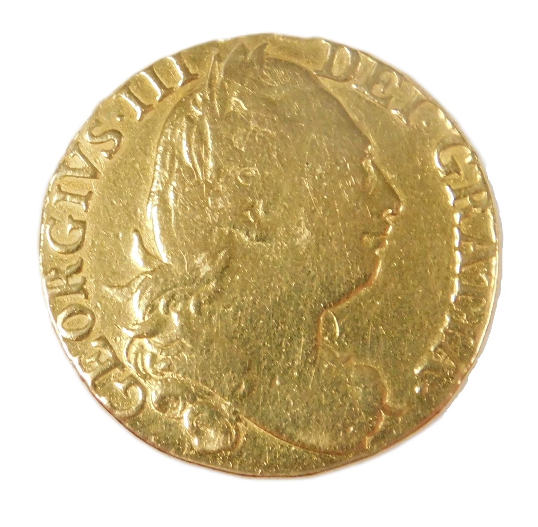 A George II gold guinea 1781, the obverse with laureate head, reversed with crowned shield of arms, - Image 2 of 3