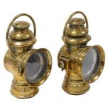 A pair of Nirona number 12 brass car oil lamps, 28cm high.