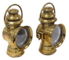 A pair of Nirona number 12 brass car oil lamps, 28cm high.