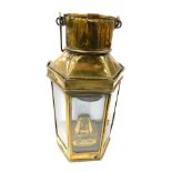 An early 20thC brass ship's storm lantern, by Eli Griffiths and Sons 1910, with burner and key, 40.5